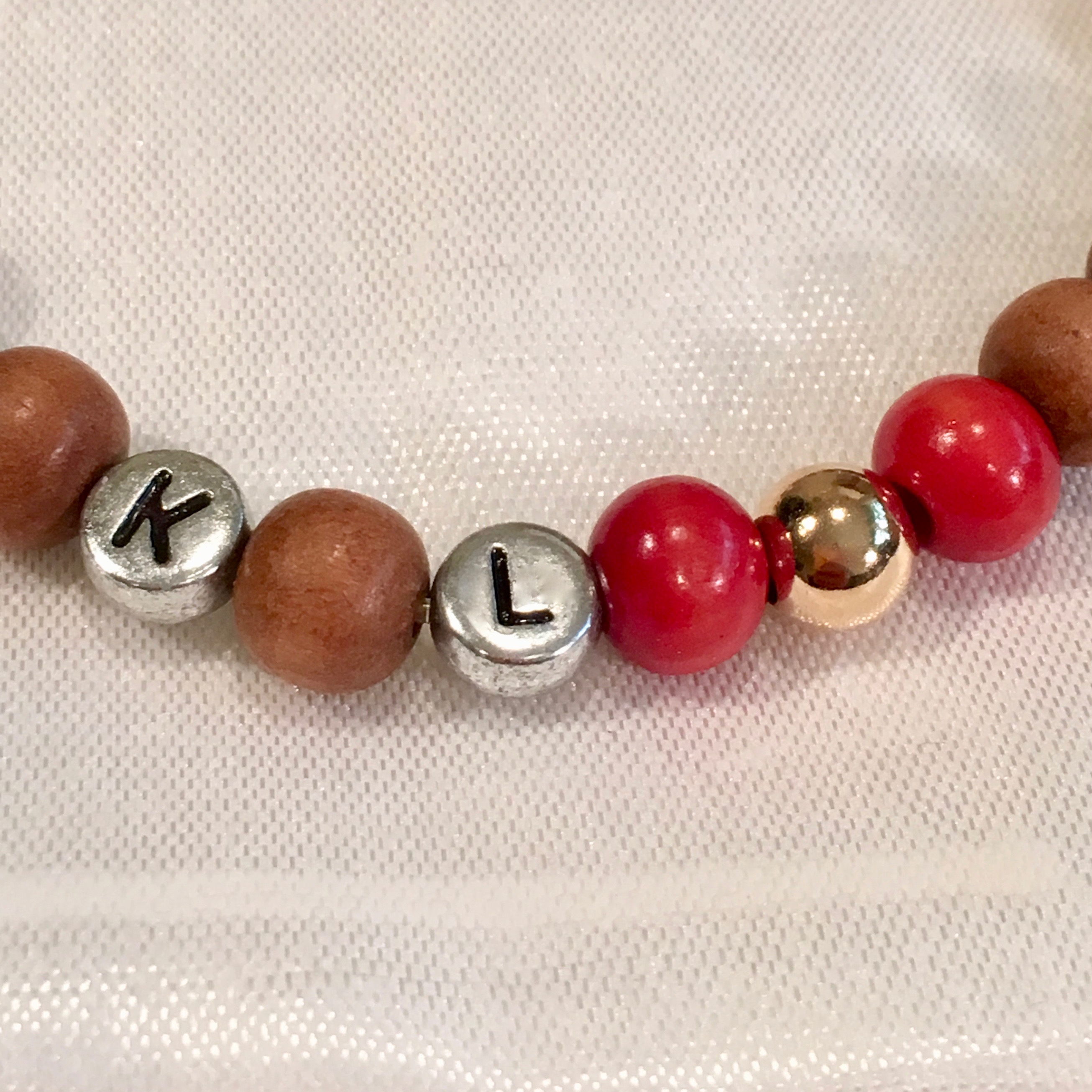 Close up picture of lettered beads kindness and love